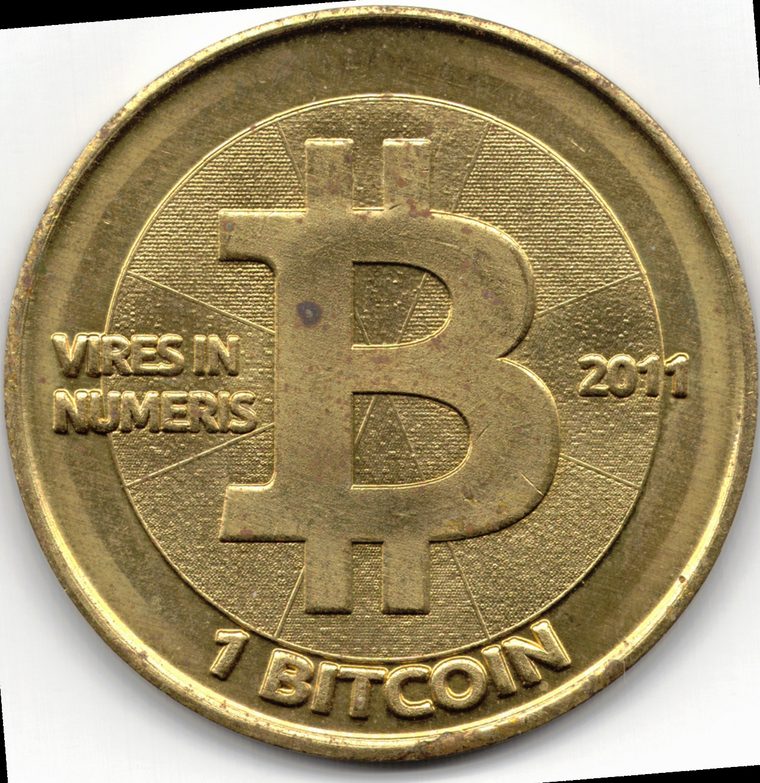 A physical Bitcoin coin representing JD Vance's cryptocurrency holding
